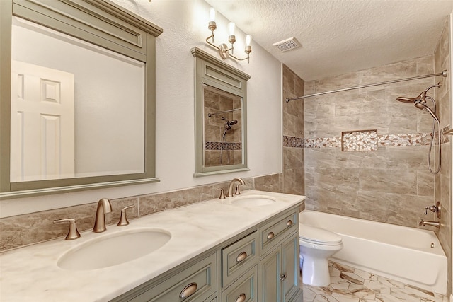 bathroom with visible vents, a sink, a textured ceiling, and toilet