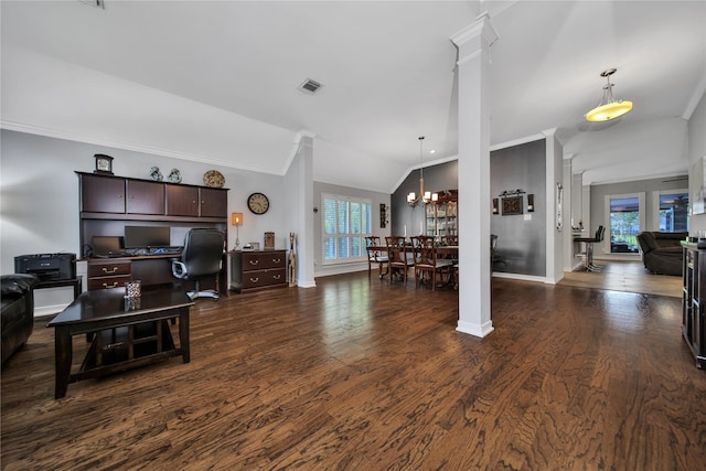 living room featuring dark hardwood / wood-style floors, an inviting chandelier, a wealth of natural light, and lofted ceiling