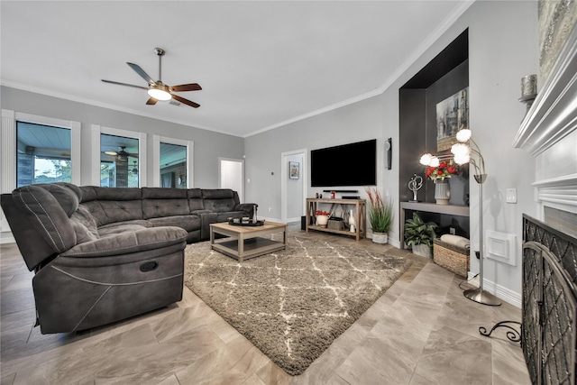 living room with ceiling fan and ornamental molding