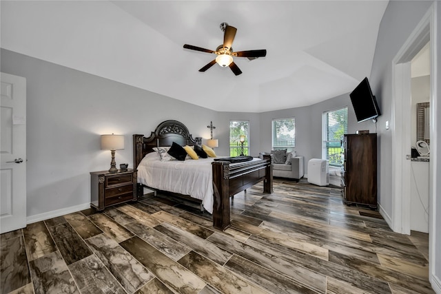 bedroom with a tray ceiling and ceiling fan