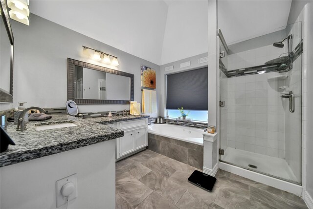 bathroom with vanity and independent shower and bath