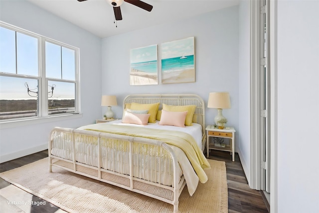 bedroom featuring dark hardwood / wood-style floors and ceiling fan