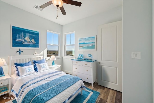 bedroom featuring hardwood / wood-style floors and ceiling fan