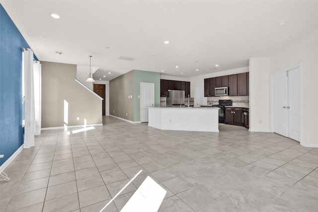 unfurnished living room with light tile patterned floors