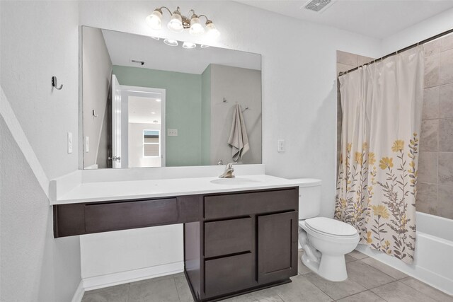 full bathroom featuring tile patterned floors, vanity, toilet, and shower / bath combo with shower curtain