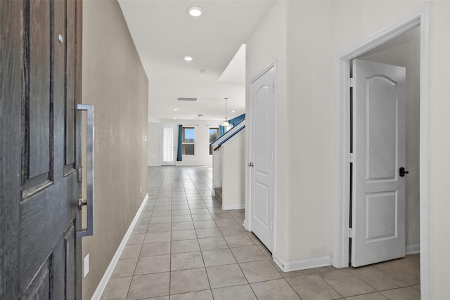 foyer with light tile patterned floors