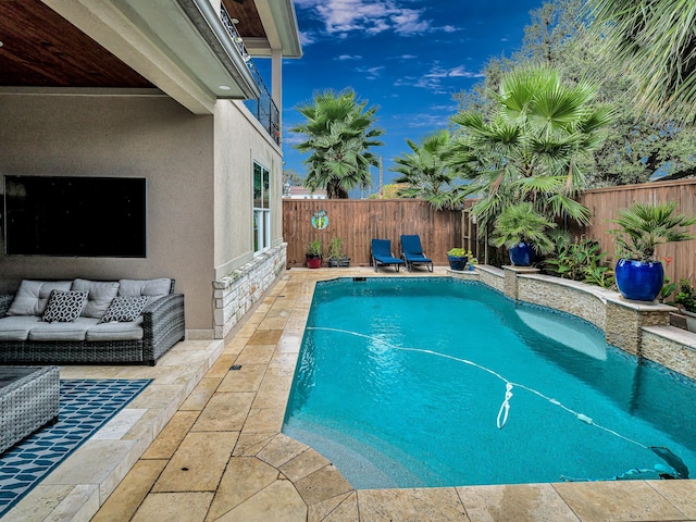 view of pool with outdoor lounge area and a patio area