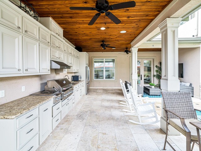 view of patio / terrace featuring area for grilling, french doors, and an outdoor kitchen