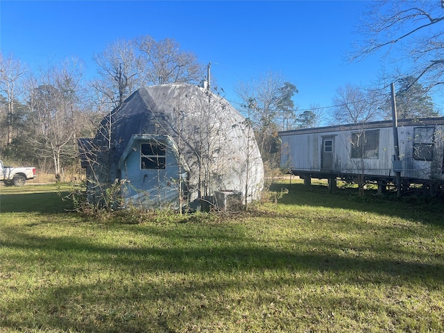 view of home's exterior featuring a yard