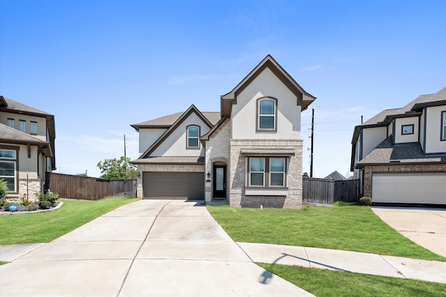 view of front of house featuring a garage and a front lawn