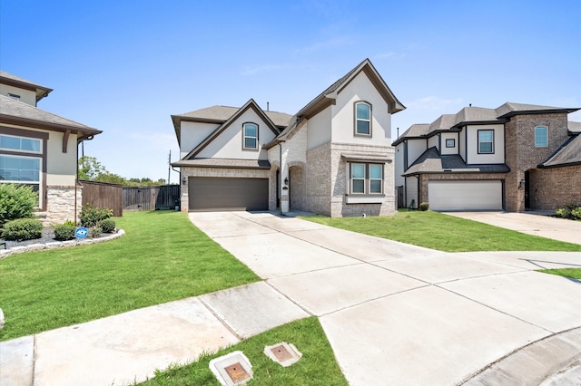 view of front of property featuring a garage and a front yard