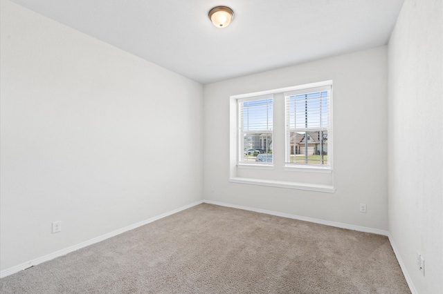 unfurnished room with carpet flooring