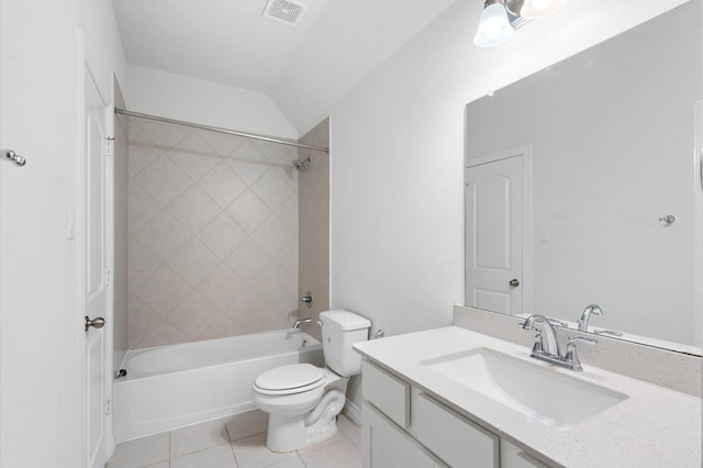 full bathroom with vanity, lofted ceiling, tile patterned floors, tiled shower / bath combo, and toilet