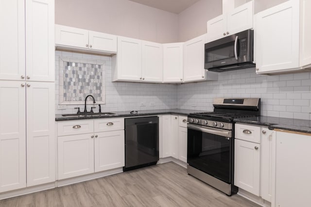 kitchen with backsplash, stainless steel appliances, sink, light hardwood / wood-style flooring, and white cabinets