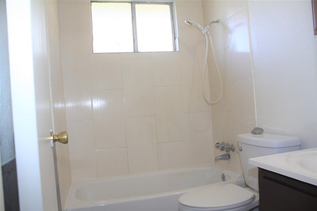 full bathroom featuring vanity, toilet, and tiled shower / bath