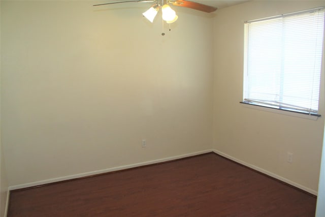 unfurnished room featuring ceiling fan and dark wood-type flooring