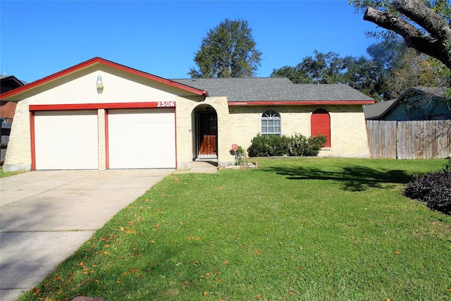 single story home with a garage and a front lawn