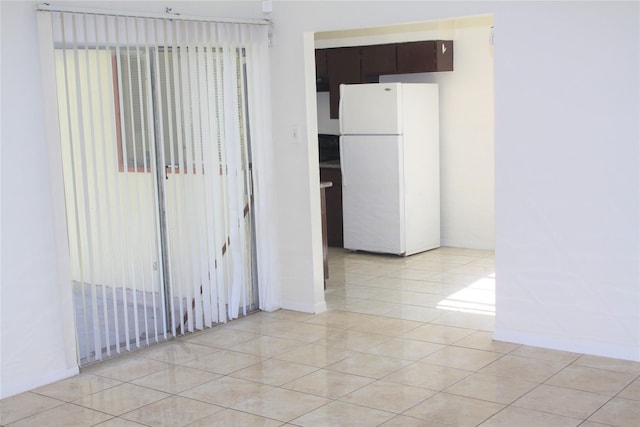 empty room featuring light tile patterned floors