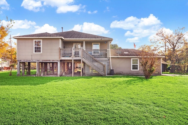 back of house featuring a yard