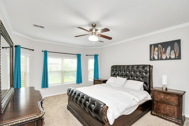 bedroom featuring ceiling fan, crown molding, and carpet floors