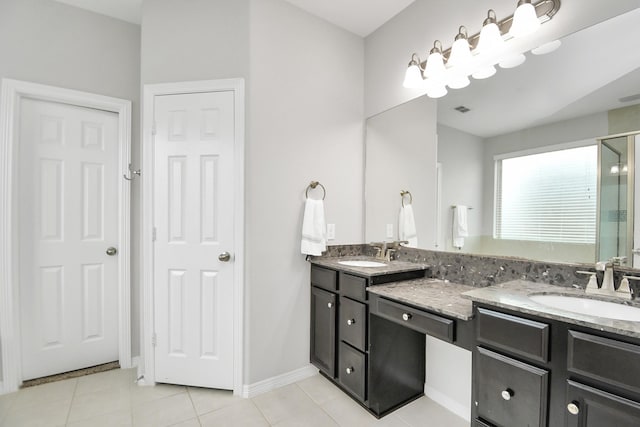 bathroom featuring tile patterned flooring and vanity