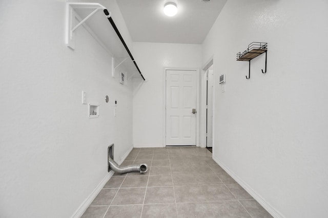 clothes washing area featuring hookup for a gas dryer, light tile patterned floors, and hookup for a washing machine