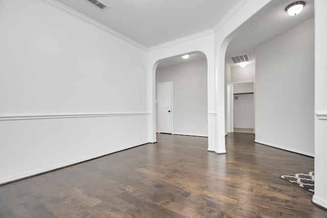 unfurnished room featuring dark hardwood / wood-style floors and ornamental molding