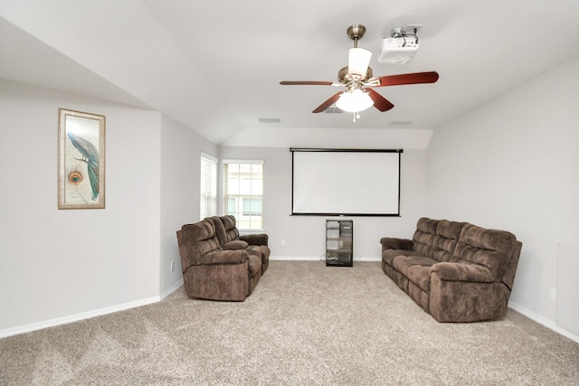 home theater featuring ceiling fan, carpet, and lofted ceiling