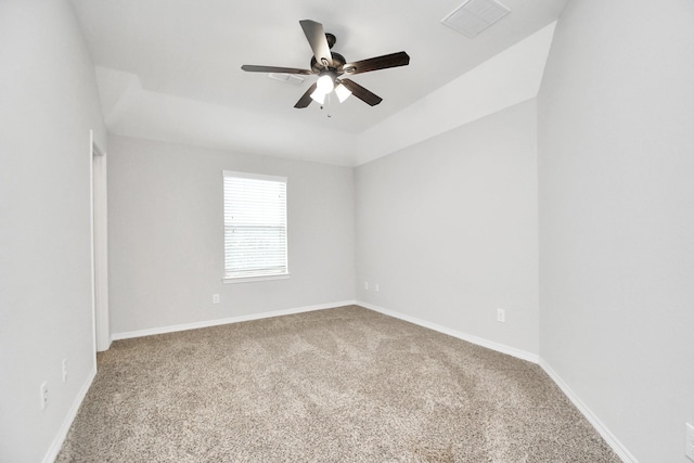 carpeted empty room with ceiling fan and lofted ceiling