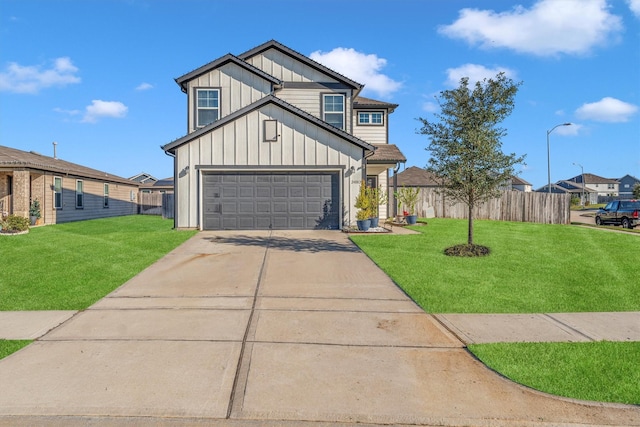 view of front of property with a front yard and a garage