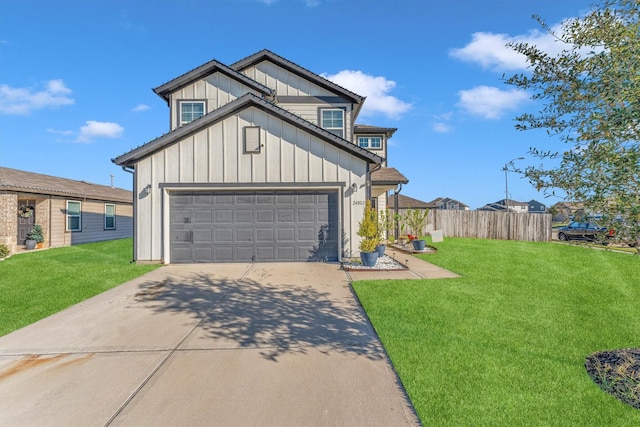 view of front of house featuring a garage and a front lawn