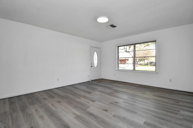 unfurnished room with dark hardwood / wood-style floors