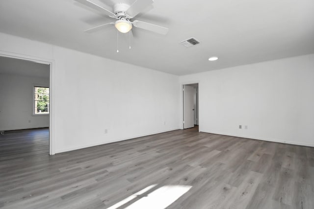 spare room with ceiling fan and light hardwood / wood-style flooring