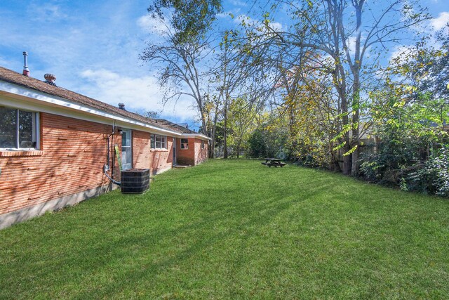 view of yard featuring central AC