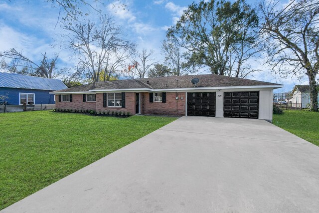 ranch-style home featuring a garage and a front lawn