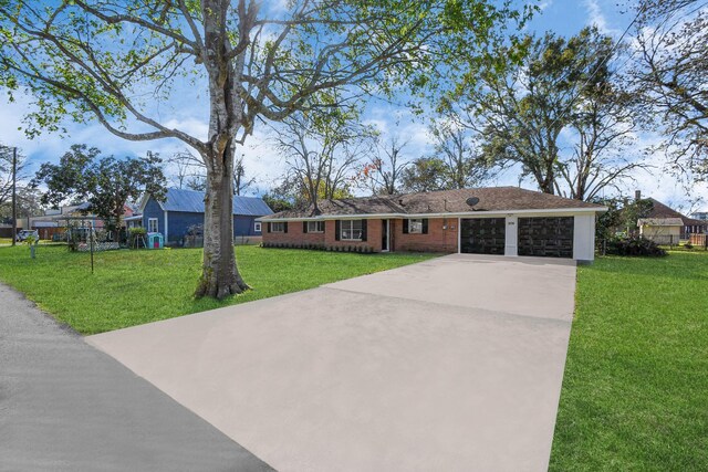 ranch-style home with a garage and a front yard