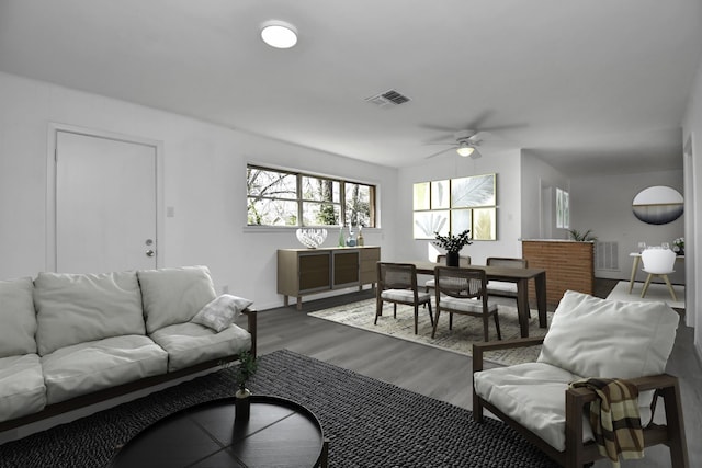 living room with hardwood / wood-style flooring and ceiling fan