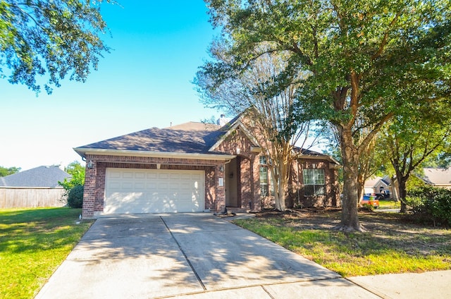 view of front of home featuring a garage and a front lawn