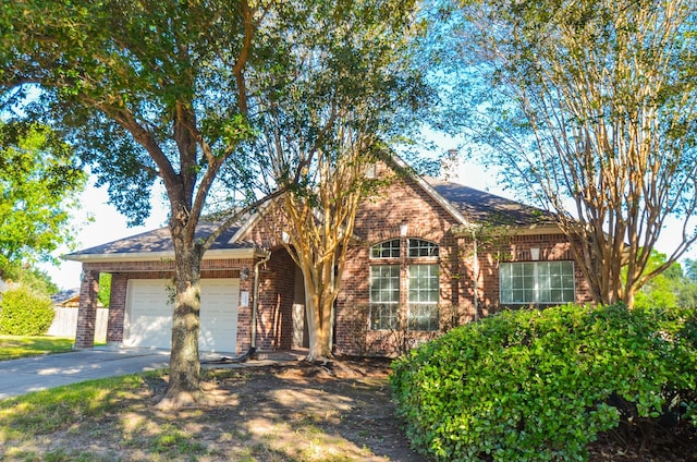 ranch-style home featuring a garage