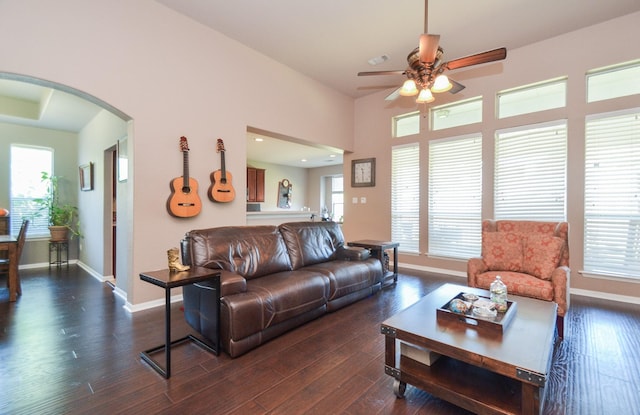 living room featuring dark hardwood / wood-style flooring, plenty of natural light, and ceiling fan