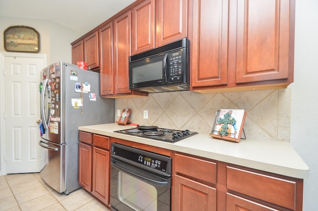 kitchen with backsplash, light tile patterned floors, and black appliances