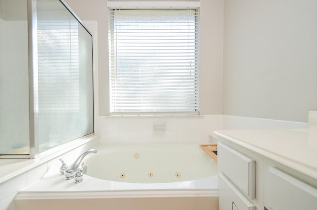 bathroom featuring a bathtub and plenty of natural light