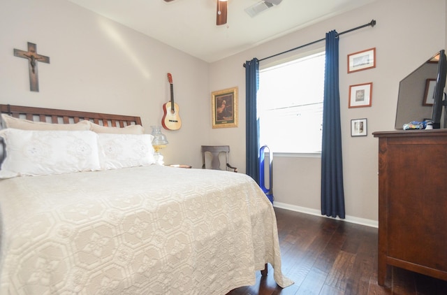 bedroom featuring ceiling fan and dark hardwood / wood-style floors