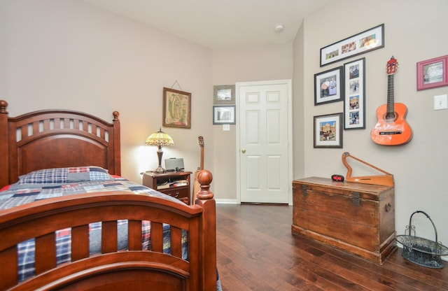 bedroom featuring dark wood-type flooring