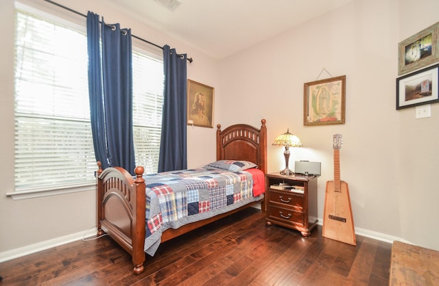 bedroom featuring dark wood-type flooring