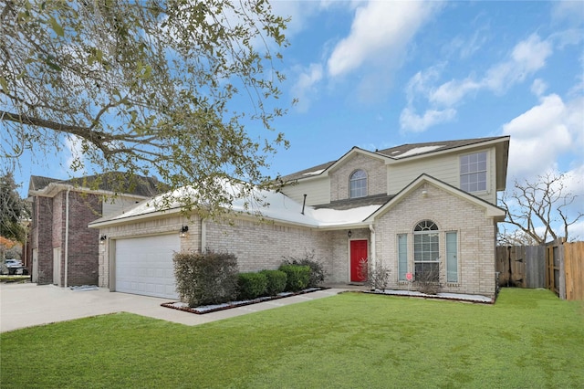 view of property with a garage and a front lawn