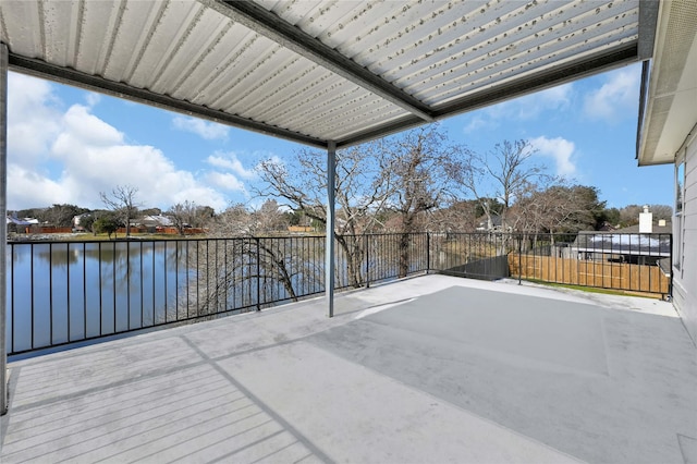 view of patio with a water view