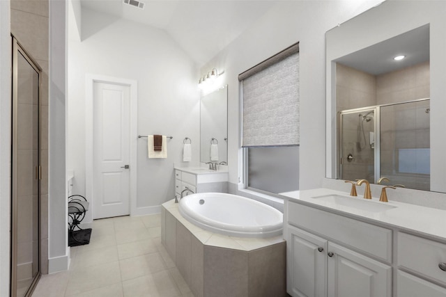 bathroom with vanity, tile patterned floors, lofted ceiling, and separate shower and tub