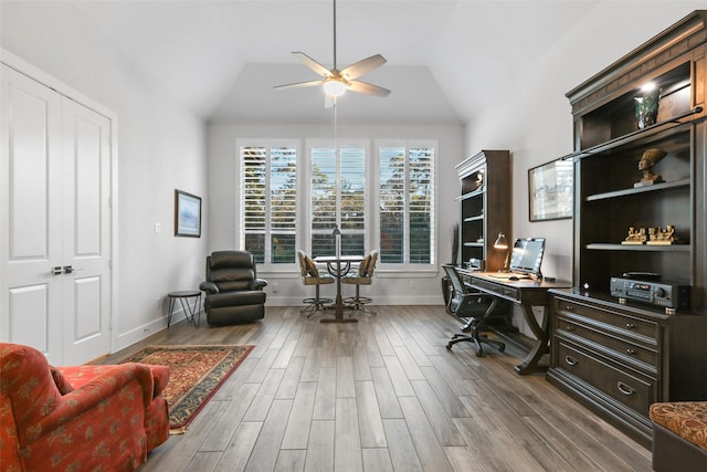 office with hardwood / wood-style floors, vaulted ceiling, and ceiling fan