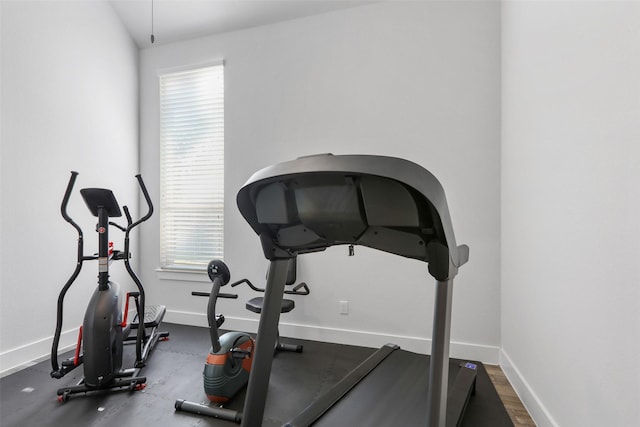 workout room with lofted ceiling